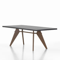 Modern black tabletop with angular brown legs, creating a sleek and stylish contrast for contemporary decor.