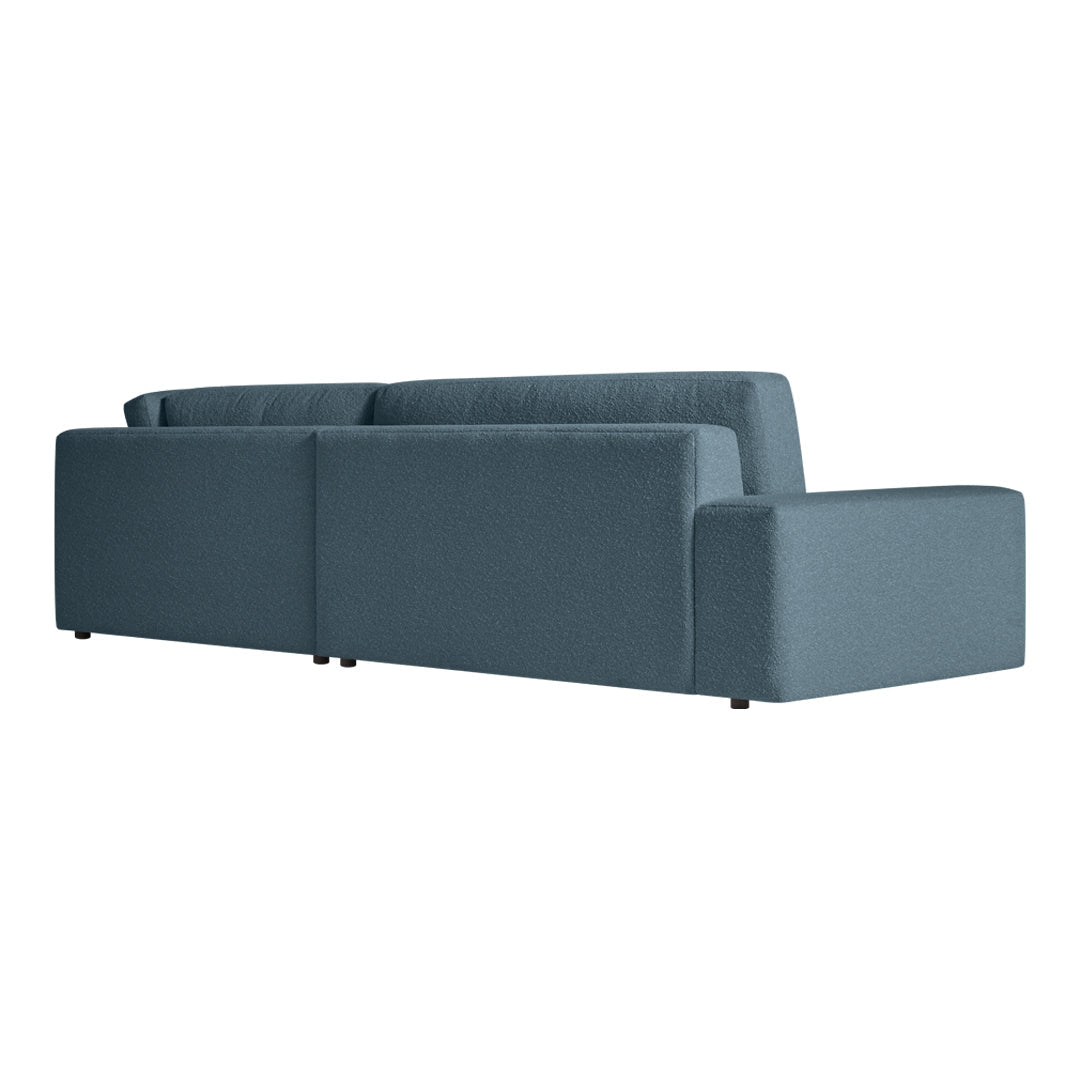Modern two-tone sofa in soft teal blue fabric with clean lines and minimalist design. Perfect for contemporary decor.