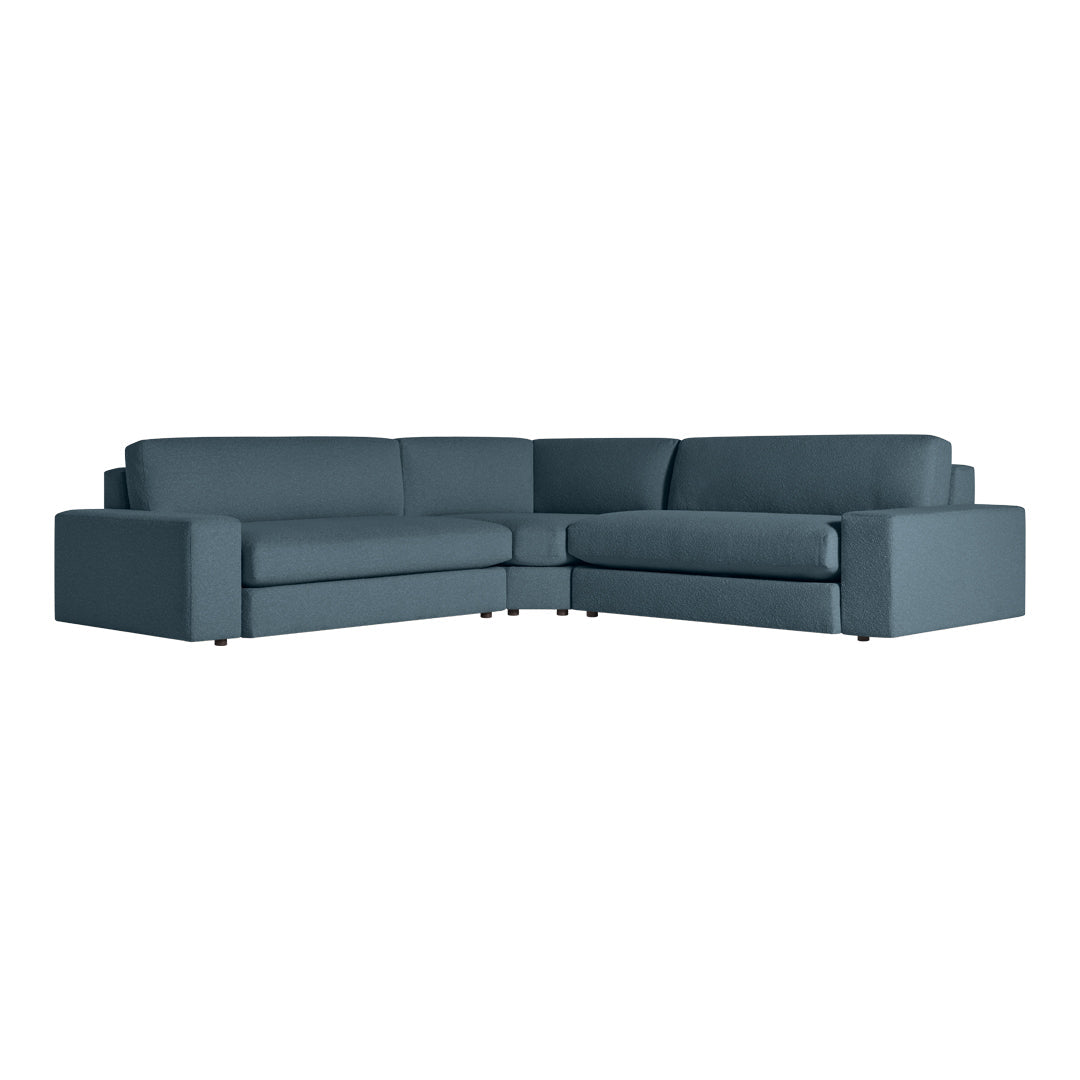 Stylish dark teal sectional sofa with a modern, sleek design and smooth fabric upholstery. Perfect for contemporary spaces.