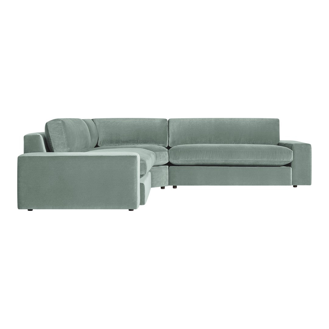 Light green velvet sectional sofa with a smooth, minimalist design and subtle texture. Perfect for modern interiors.