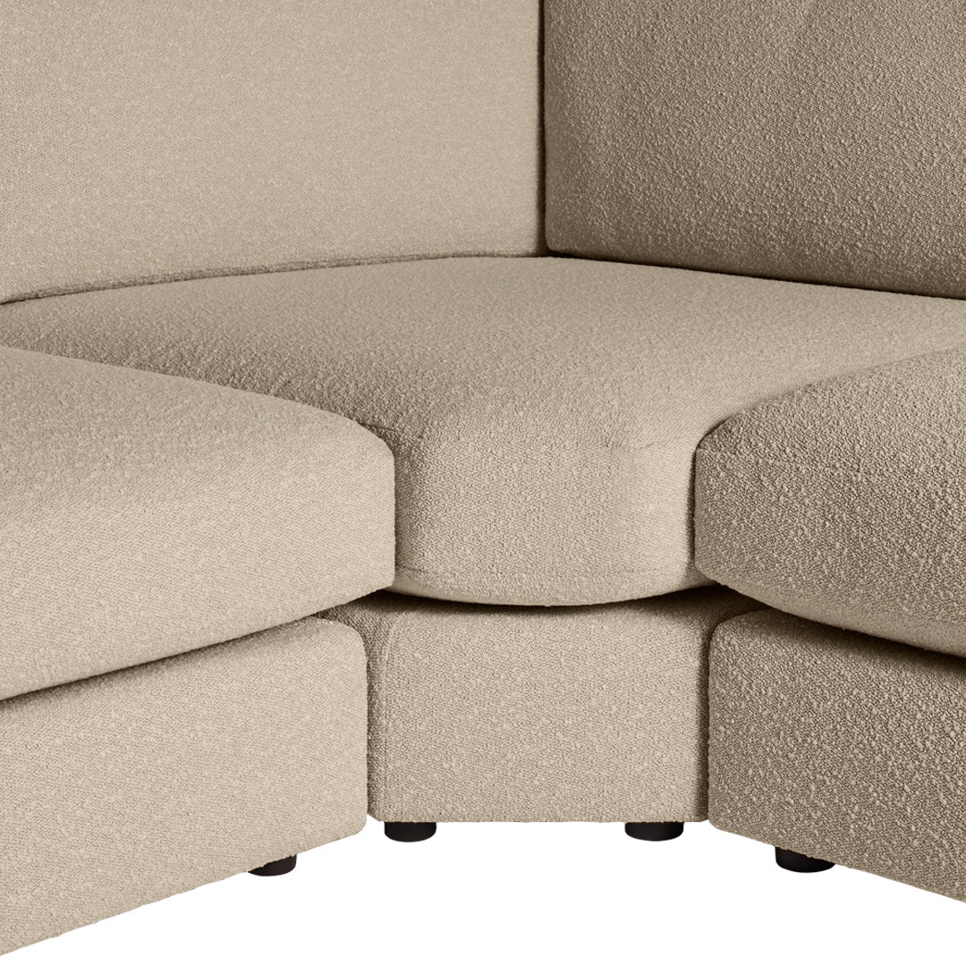 Textured beige corner sofa with soft, cozy fabric and rounded edges. Perfect for stylish and comfortable living spaces.