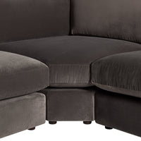 Soft, dark gray sectional sofa featuring a smooth, plush fabric and seamless design for modern elegance.