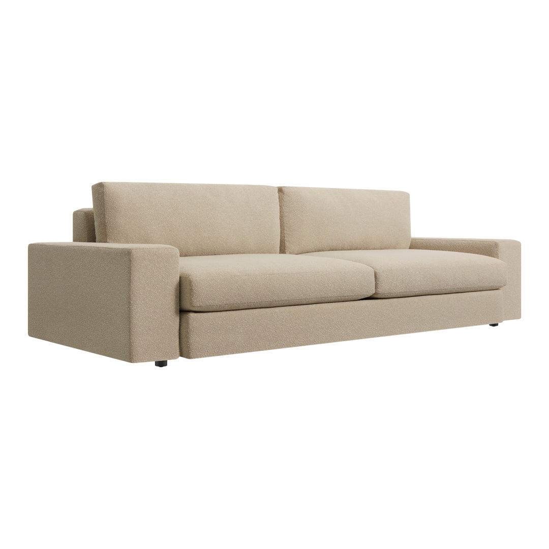 Light beige fabric sofa with a simple, modern design and clean lines, perfect for versatile living spaces.