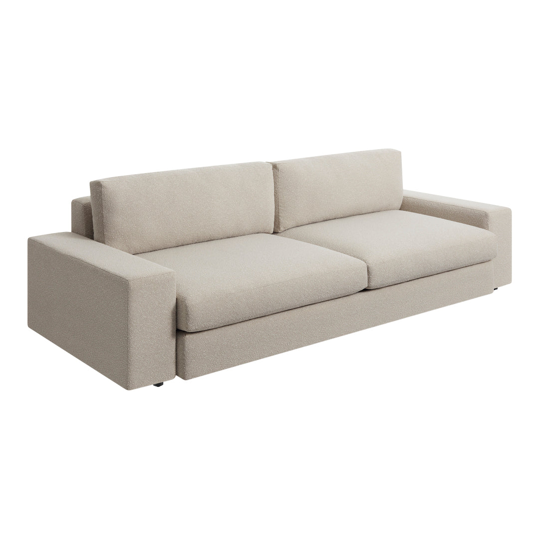 Beige fabric sofa with a minimalist design and smooth, clean lines. Perfect for contemporary living spaces.