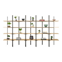 Modern wood and black metal shelving unit with open design, featuring light wood tones and minimalistic decor accents.