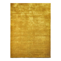"Solid golden area rug with a soft texture and subtle sheen, perfect for adding warmth to any space."