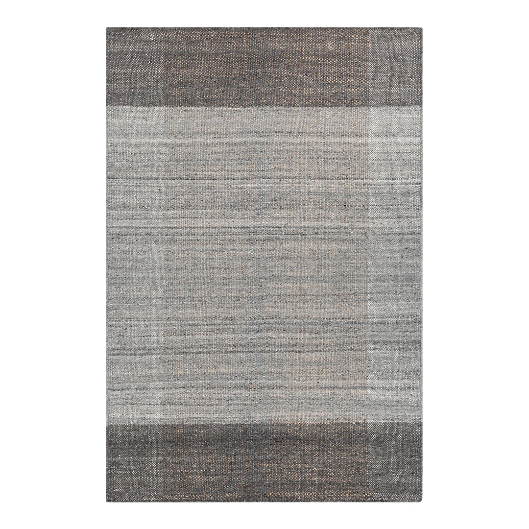 Gray area rug featuring textured stripes in varying shades of gray and taupe. Perfect for modern decor.