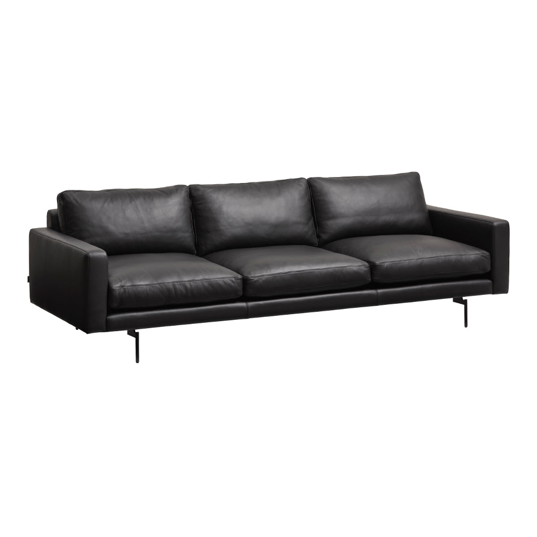 Sleek black leather sofa with smooth texture and modern design, perfect for contemporary living spaces.