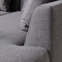 Gray textured sofa fabric with subtle patterns, showcasing a modern and minimalist design.