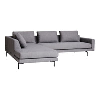 Gray sectional sofa with a sleek design and smooth fabric, featuring solid colors and minimalistic patterns.