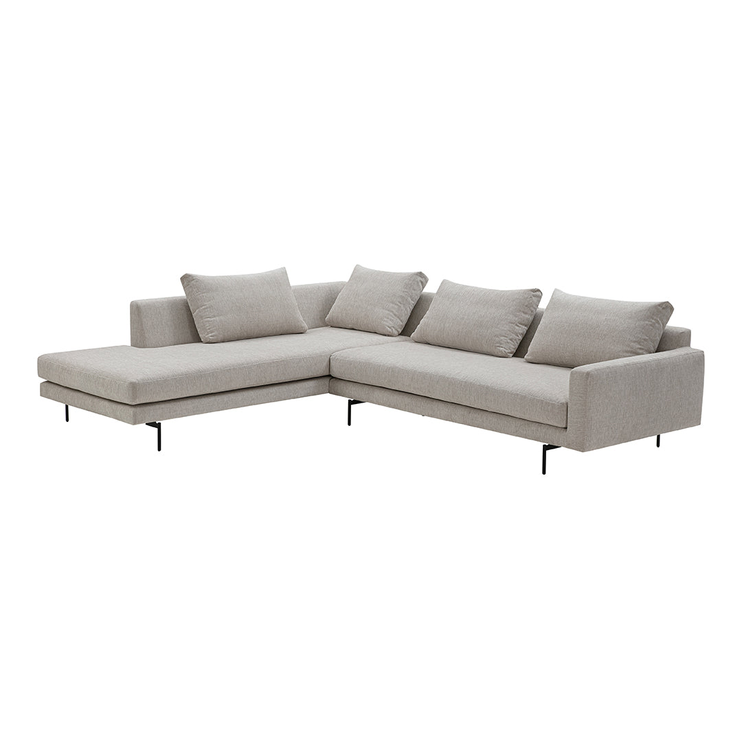 Light gray modular sectional sofa with soft textured fabric and subtle patterned cushions. Ideal for modern decor.