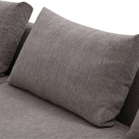 Gray textured throw pillow on a sleek, modern sofa. Ideal for contemporary decor. 