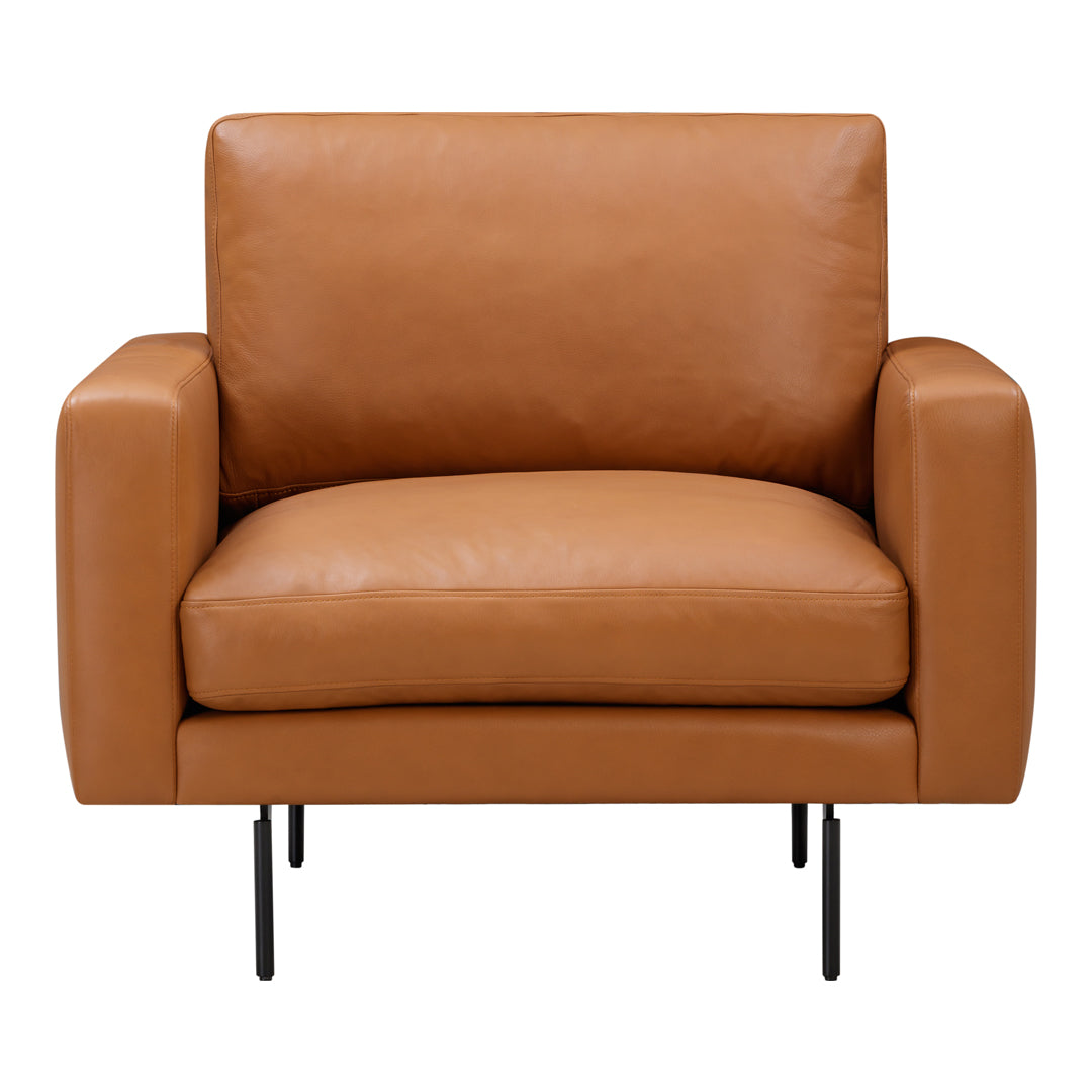 Tan leather armchair with a smooth finish and minimalist design, featuring short black metal legs.