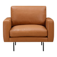 Tan leather armchair with a smooth finish and minimalist design, featuring short black metal legs.