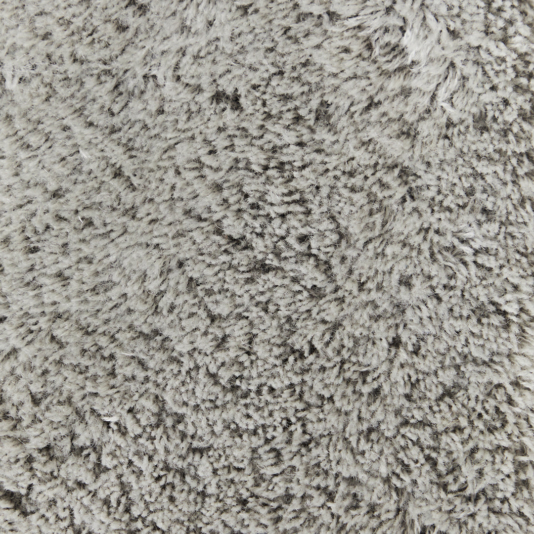 Soft gray shag carpet with a plush, textured pattern, ideal for modern home decor.
