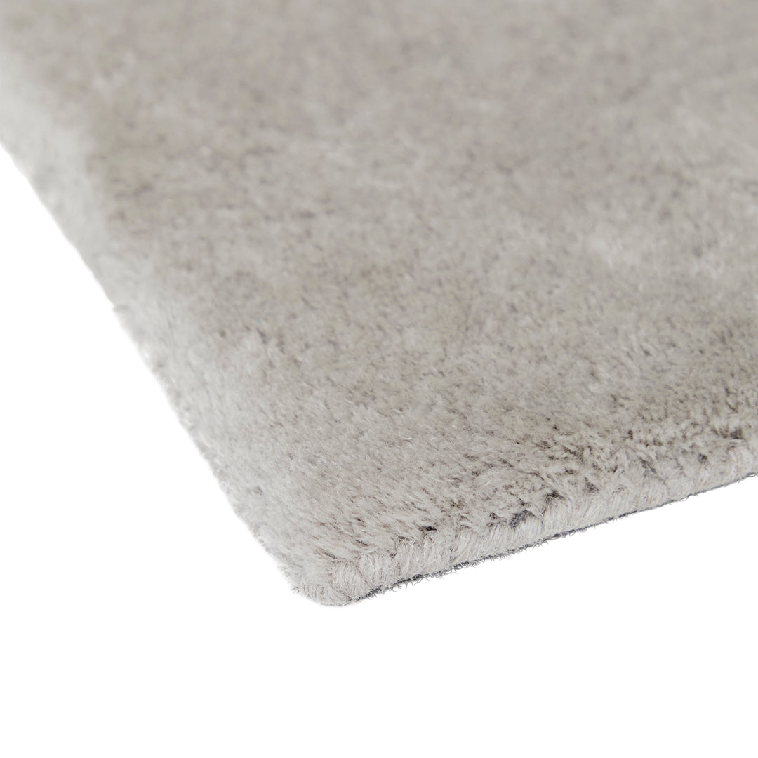 Soft gray plush rug with a sleek, solid texture, perfect for modern decor.