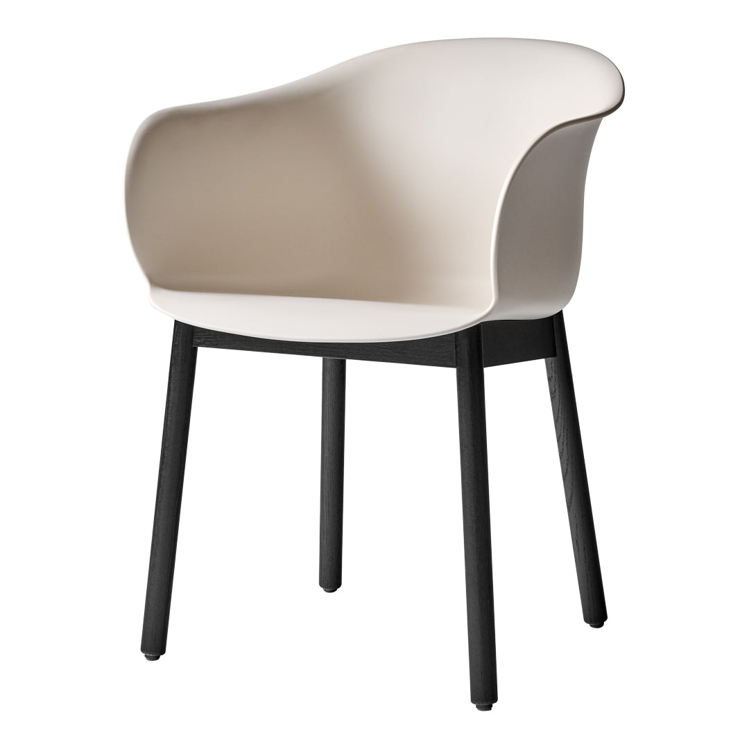 Cream-colored chair with a smooth, curved seat and contrasting black legs for a modern, minimalist look.