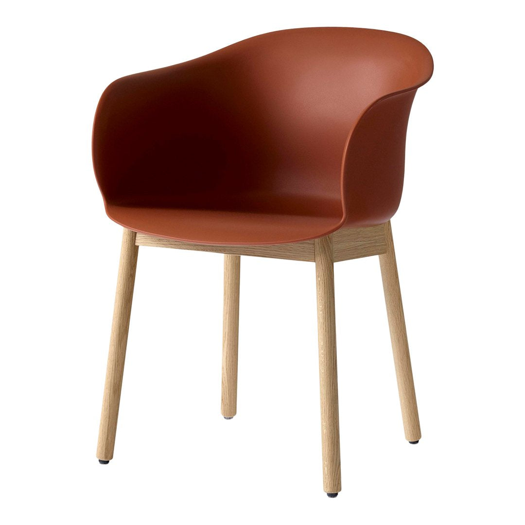 Rust-orange molded chair with natural wood legs, featuring a sleek, modern design and smooth curves.