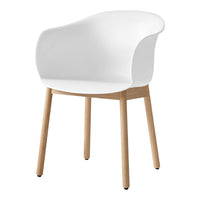 White modern chair with a smooth finish and natural wooden legs, perfect for minimalist decor.