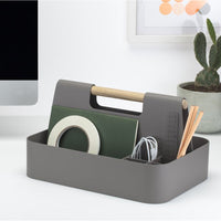 Gray organizer with wood handle, featuring green, white, and natural tones in a modern, minimalist design.