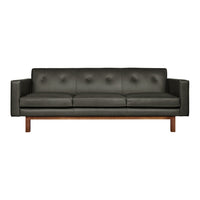 Dark gray leather sofa with tufted design and wooden legs, offering a modern and sleek aesthetic.