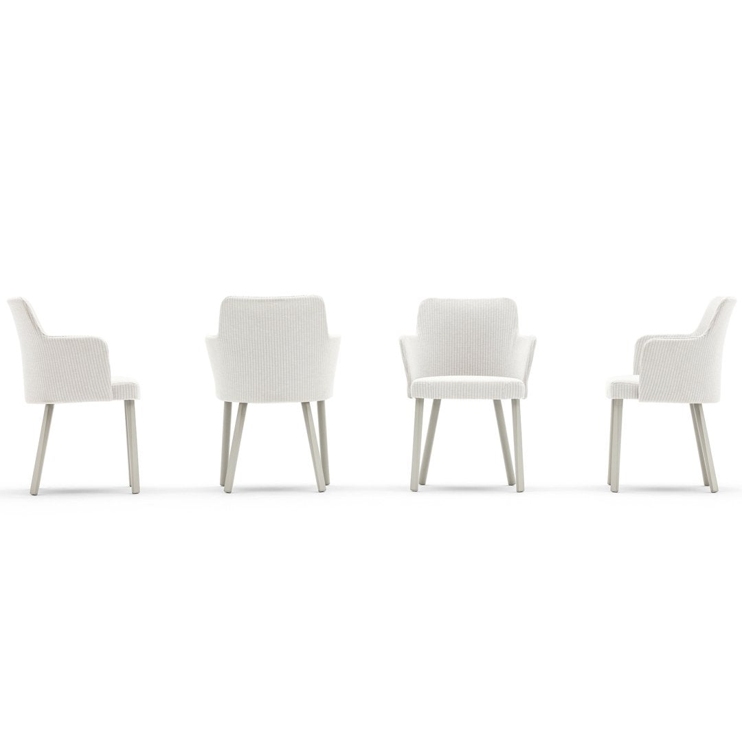 Set of four elegant white chairs with smooth lines and light wooden legs, perfect for modern decor.