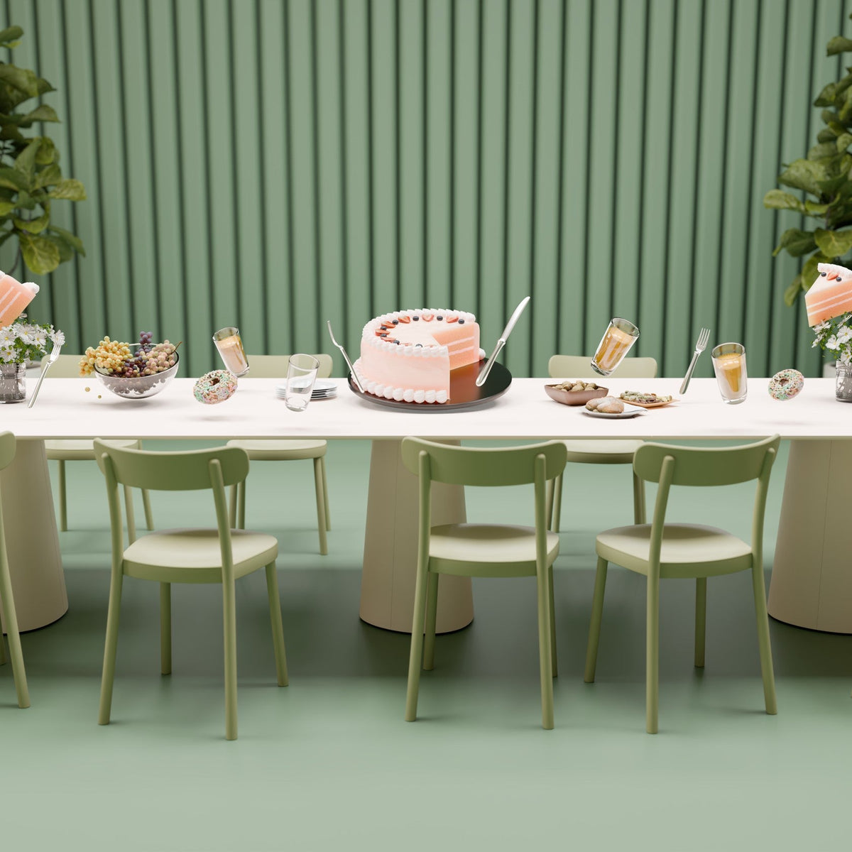 Elegant pastel pink and green dining setup with a white table, featuring stylish chairs and decorative elements.