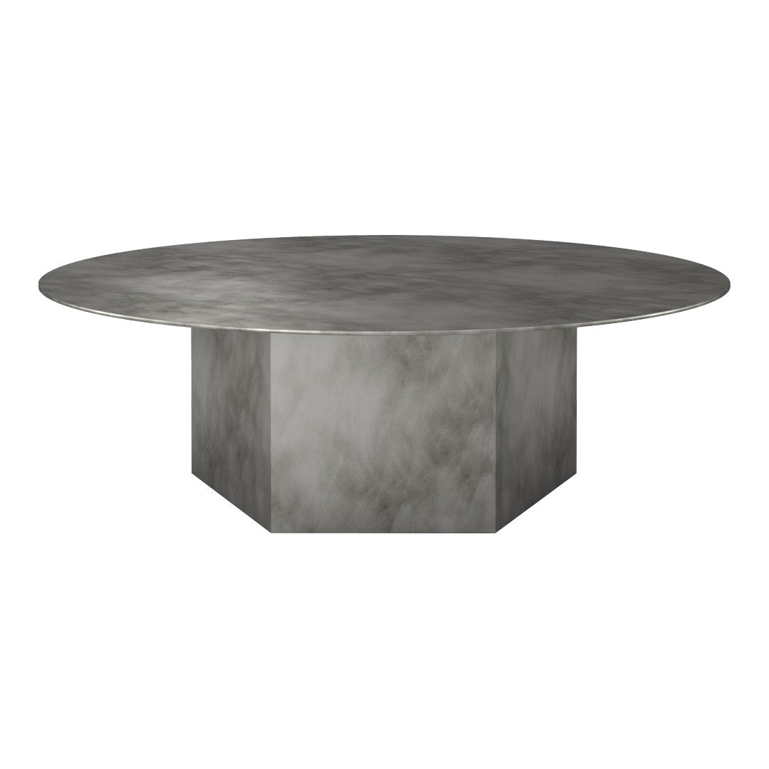 Round concrete dining table with a smooth gray finish and subtle marbled texture, featuring a geometric base.