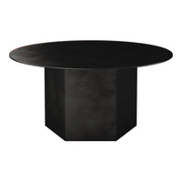 Sleek round black dining table with a geometric base, featuring a matte finish for a modern look.