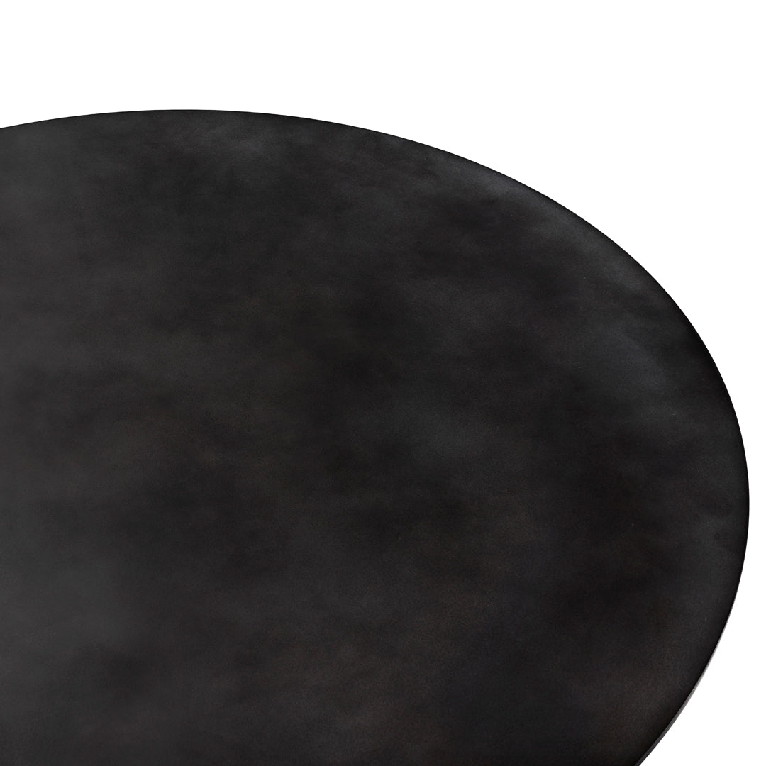 Black round table surface with a smooth, matte finish and subtle texture variations. Ideal for modern decor.