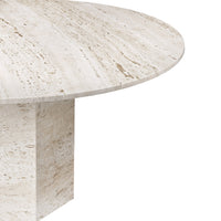 Neutral beige round table with subtle textured patterns, featuring a smooth finish and minimalist design.
