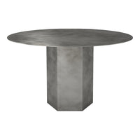 Round gray dining table with a polished finish and geometric base, creating a modern and sleek aesthetic.