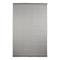 Light gray woven rug with a subtle texture and dark gray fringed edges, perfect for minimalist decor.