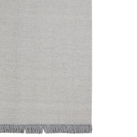Light gray scarf with subtle texture and delicate fringe detail at the ends. Perfect for layering.
