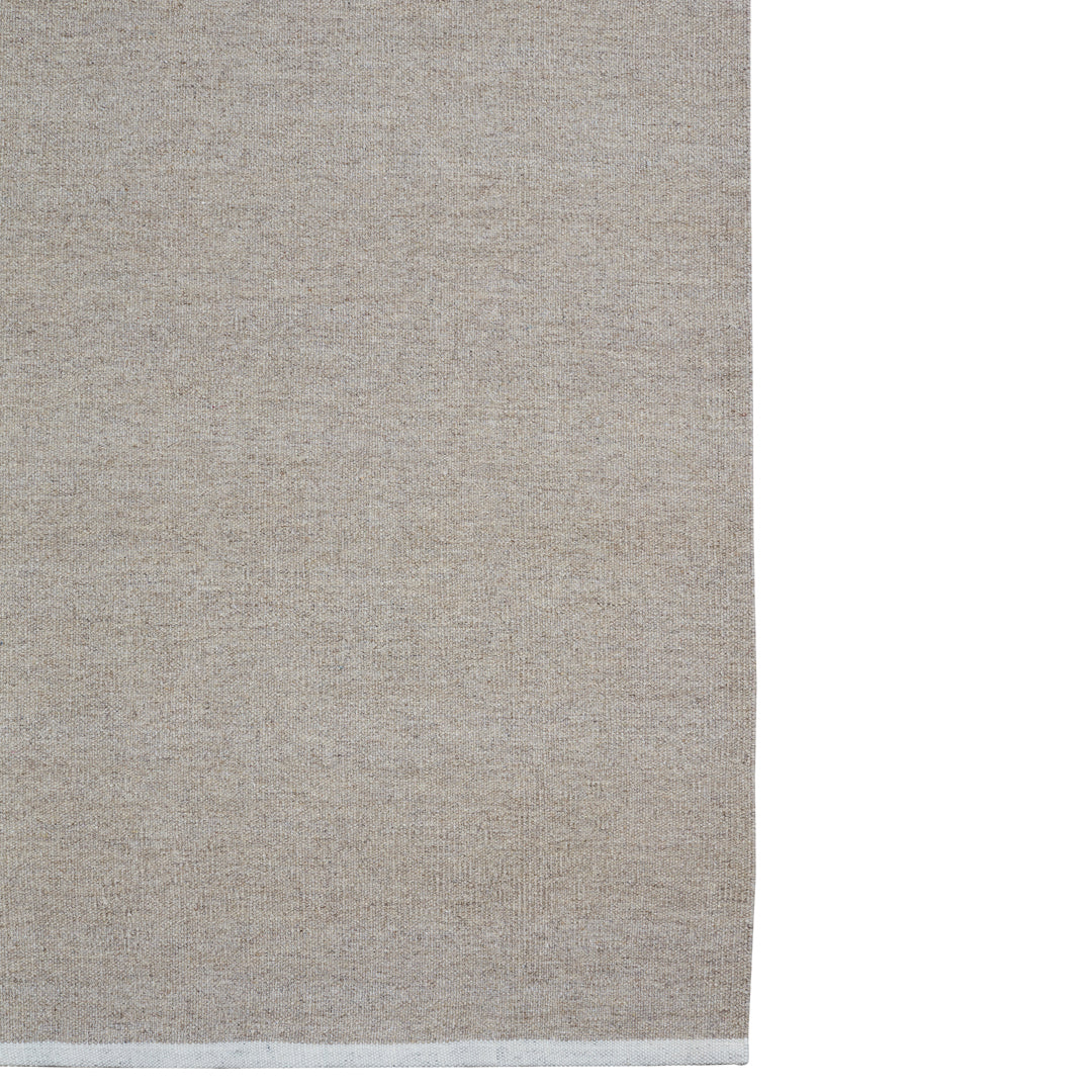 Tan textured fabric with a subtle woven pattern; perfect for various home decor styles.