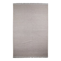 Soft taupe area rug with a subtle textured pattern and fringed edges, perfect for modern decor.