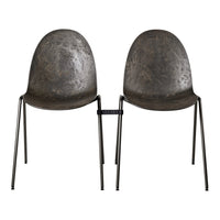 Pair of metallic gray chairs with a textured surface and black metal legs, showcasing a modern, industrial design.