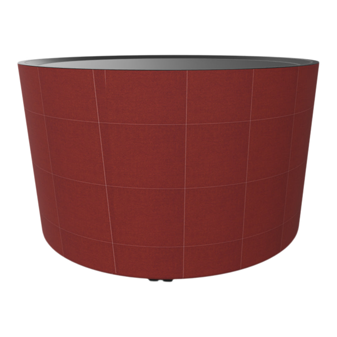 Round planter in burnt orange with subtle grid pattern and a sleek black interior. Perfect for modern decor.