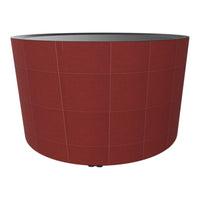 Round planter in burnt orange with subtle grid pattern and a sleek black interior. Perfect for modern decor.