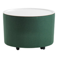 Green upholstered round coffee table with a white top and subtle texture, featuring black rolling wheels.