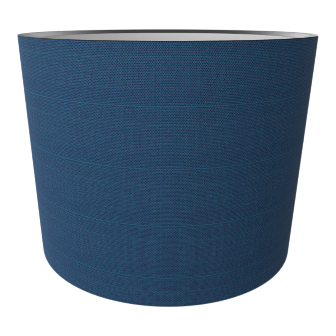 Blue textured fabric planter with subtle horizontal lines and a sleek design. Perfect for modern decor.