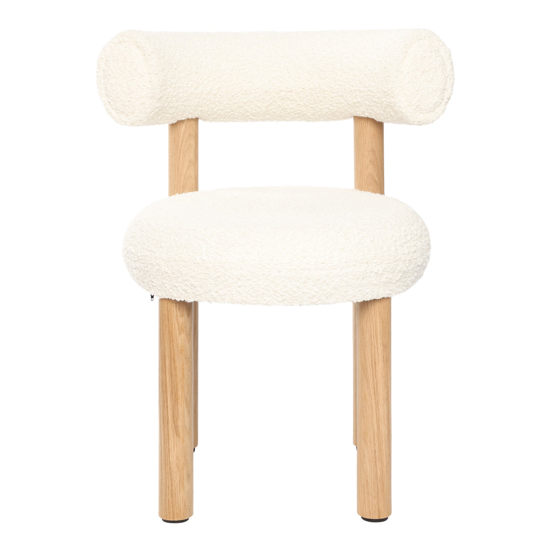 Cream upholstered chair with rounded back and seat, featuring natural wooden legs for a modern, minimalist look.