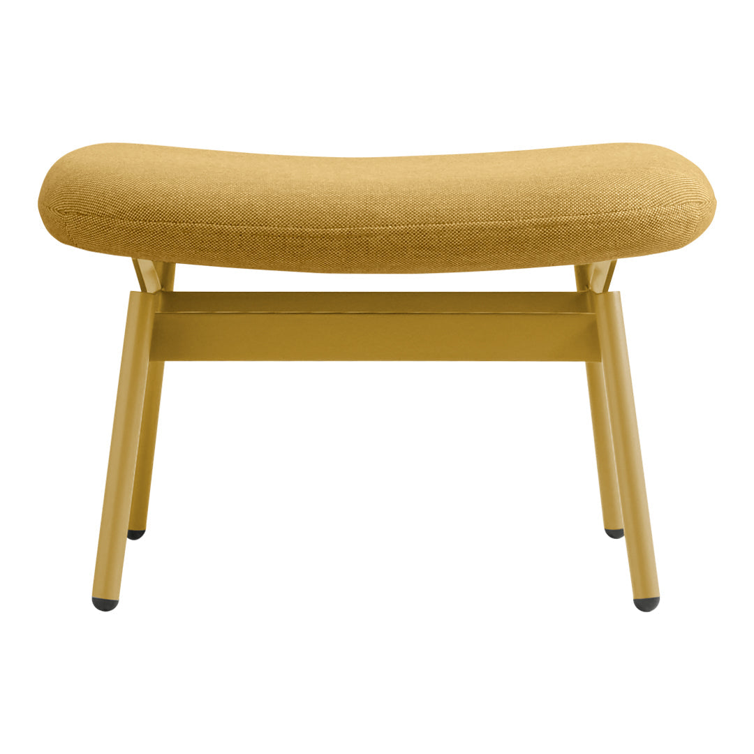"Curved bench in soft mustard yellow fabric with a minimalist light yellow frame."