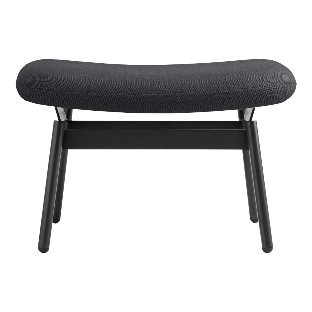 Black upholstered ottoman with smooth curves and minimalist wooden legs, perfect for modern decor.