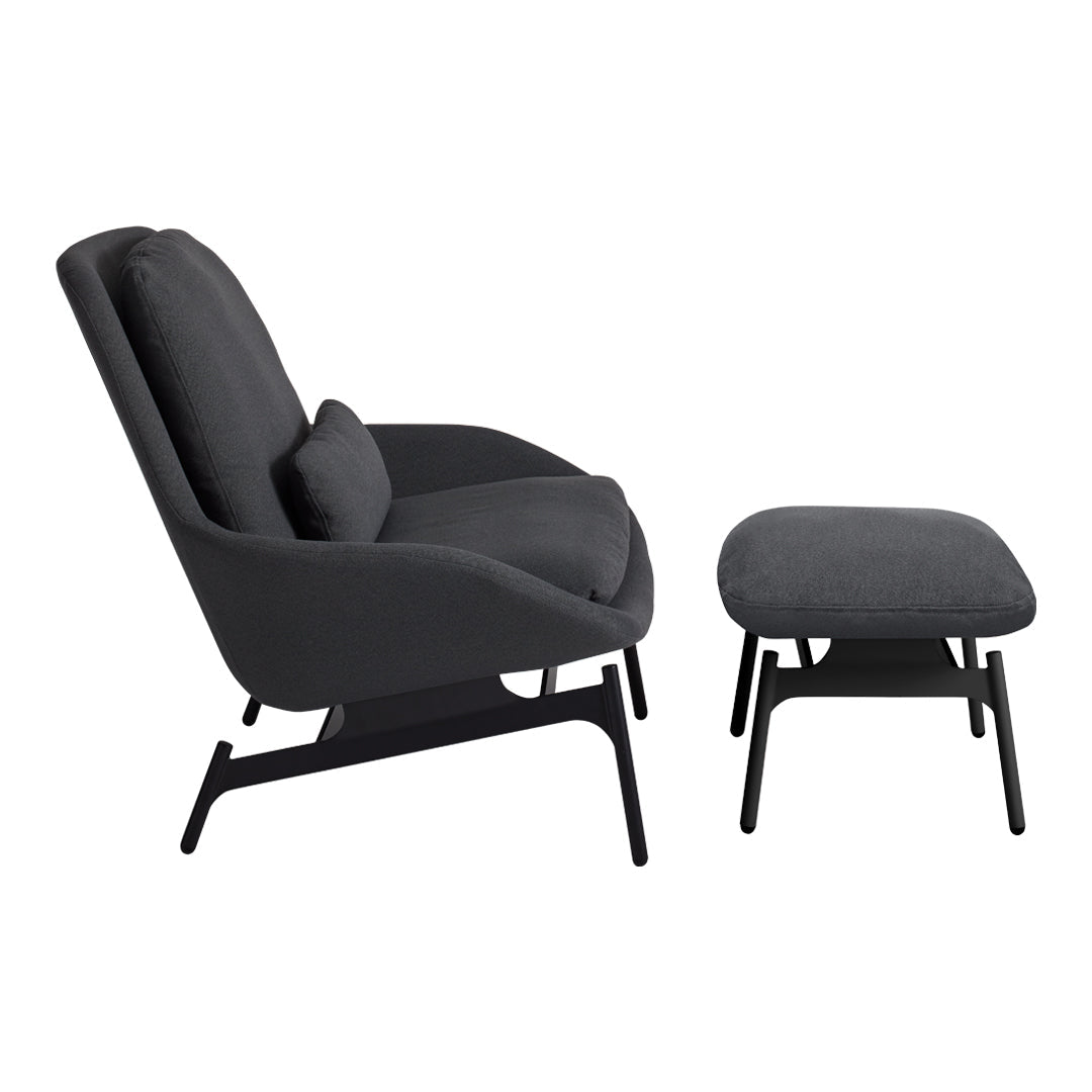 Modern black lounge chair and matching ottoman with smooth fabric and minimalist design. Perfect for stylish interiors.