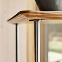 Natural wood surface with layered patterns and sleek silver metallic legs. Warm tones enhance modern aesthetics.