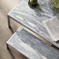 "Stylish gray and white marbled tabletop with sleek metallic legs, complemented by a minimalist design."