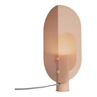 Soft peach lamp with a mesh pattern, featuring a warm glow and minimalistic design. Perfect for modern decor.