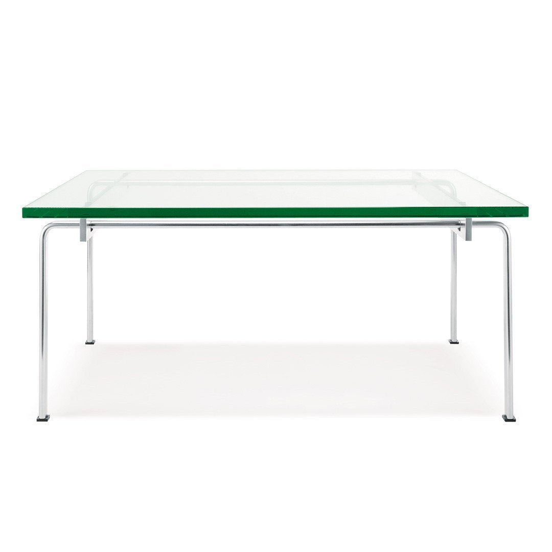 Clear glass table with a green edge and sleek chrome legs, featuring a minimalist design.