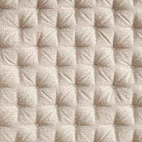 Textured beige fabric with a quilted pattern of small squares, adding depth and sophistication to any design.